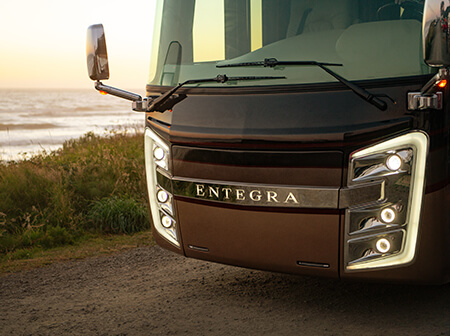 front of an Entegra Coach luxury motorhome