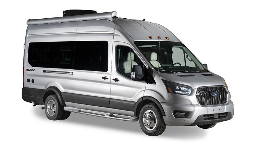 Expanse 21B Exterior | The Expanse 21B is built on the Ford® Transit AWD 350HD and features fiberglass running boards for the cab and entry doors and a keyless entry pad.