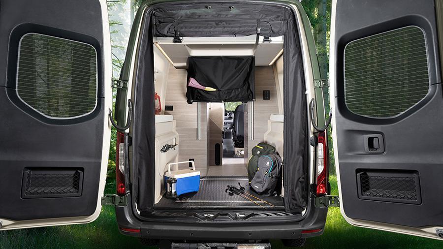 Launch 19Y Rear Garage with Bunk in Up Position | You’d never even know there was a drop-down overhead bed in the garage of the Launch 19Y when it’s in the up position. The rear screen door can roll-up and has blackout capabilities.