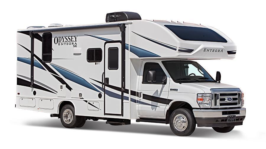 Odyssey SE Exterior | The Odyssey SE has fiberglass exterior walls with vinyl graphics, entrance door with industry’s largest travel-view window, interior entrance door grab handle, electric-powered entrance step with integrated house battery compartment and electric patio awning.