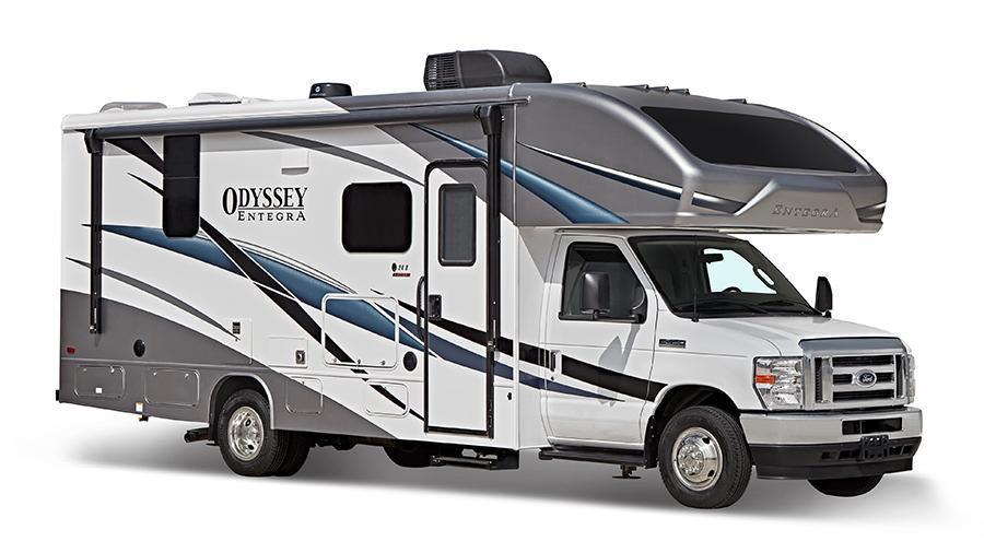 Odyssey Exterior | The Odyssey has fiberglass exterior walls with vinyl graphics, entrance door with industry’s largest travel-view window, interior entrance door grab handle, electric-powered entrance step with integrated house battery compartment, electric patio awning with LED lights and pass-through storage compartment with light (select models).
