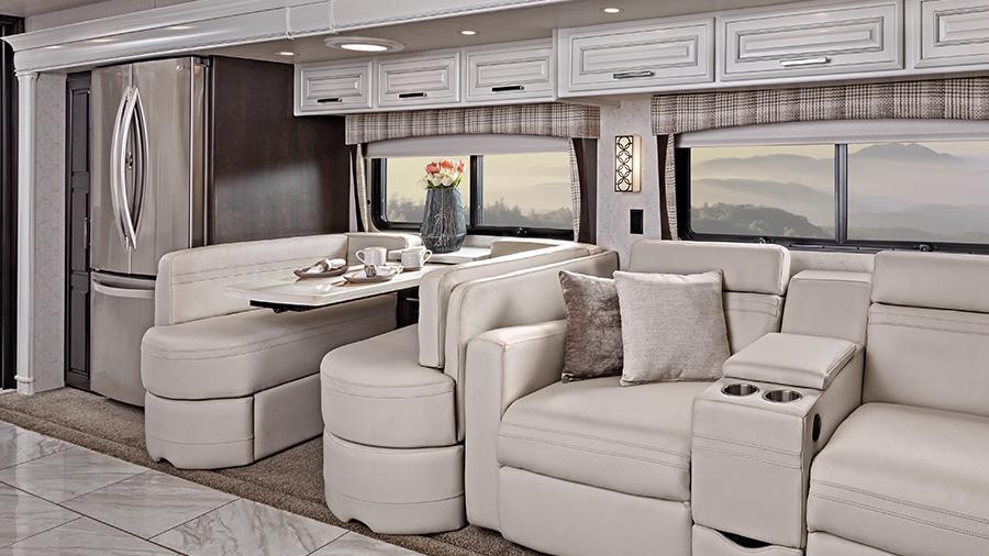 Anthem 44W Dinette and Power Theater Seating | The Anthem 44W has comfortable seating with premium leather Crown Compass furniture, including a cozy dinette booth and theater seating with power recline and fixed center console.