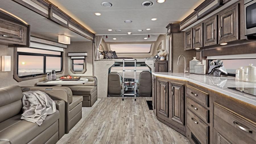 The Accolade offers additional sleeping space with its custom-molded ABS surround in cab-over area with overhead bunk with 750-pound capacity. Enjoy the view with the automotive-bonded panoramic window and power shade in the front cap. 