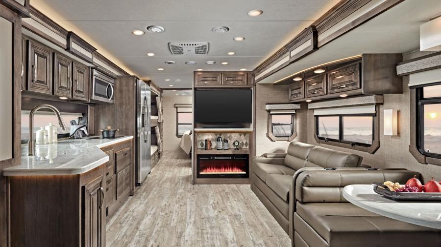 The 2023 Accolade offers luxury in a Class Super C with its high-intensity recessed LED ceiling lights, 84-inch interior ceiling height with padded vinyl ceiling, raised-panel hardwood cabinetry throughout with deluxe hidden cabinet hinges, vinyl plank flooring and day/night roller shades in the living area.