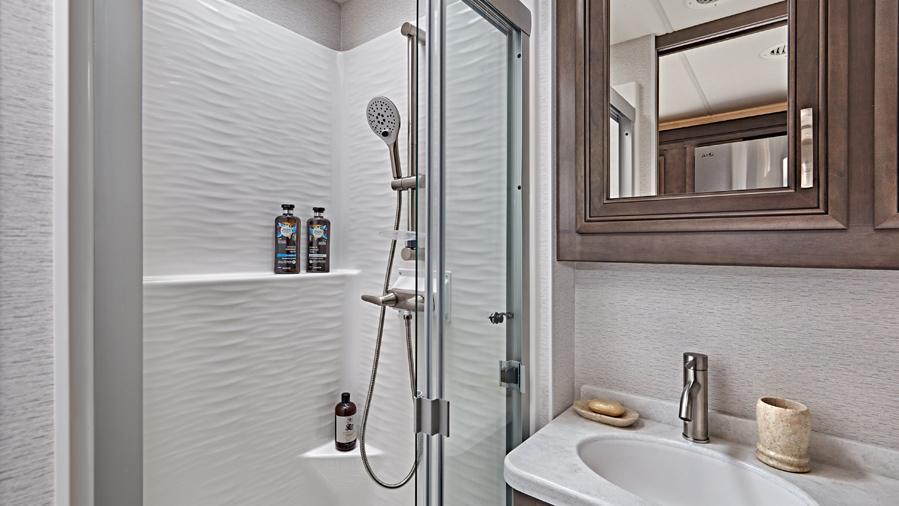 Accolade XL 37M Shower | The one-piece, fiberglass shower with a glass door, skylight and light in the Accolade XL 37M is a wonderful space to wash off the day’s adventures. 