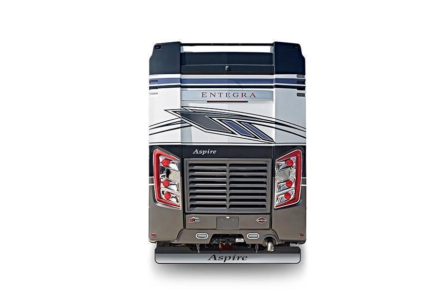 Aspire 40P Rear Exterior | The rear exterior of the Aspire 40P has the mudflap with chrome “Entegra” nameplate and power rear engine door with a manual override. 