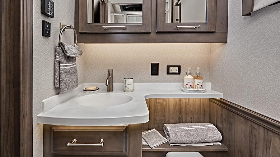 Aspire 44R Half Bath Vanity | Your guests will experience luxury, too, in the Aspire half bath, which also has solid-surface countertops with dimmable LED accent lighting and an integrated sink (44R Shown).