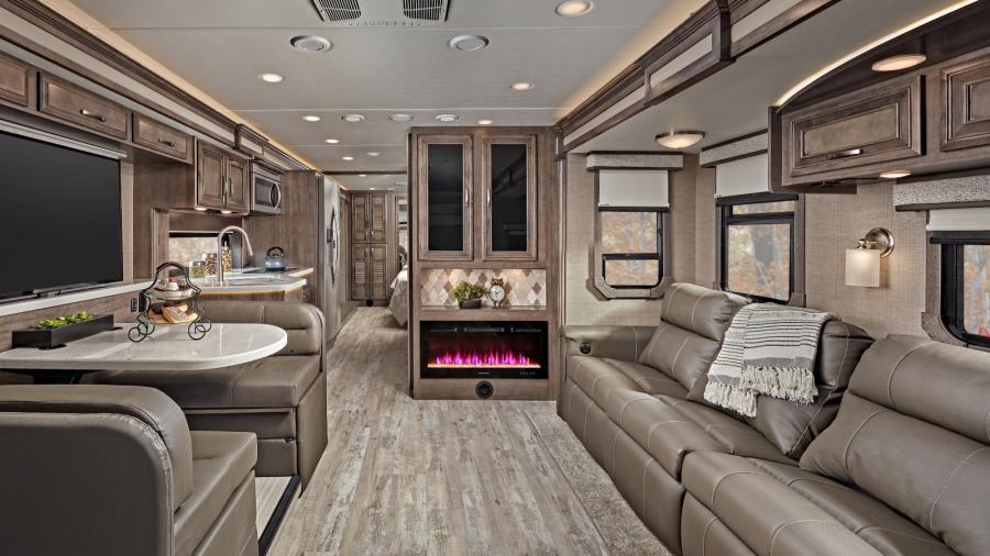 Enjoy the spacious Emblem with an 84-inch interior ceiling height and high-intensity recessed LED ceiling lights. The vinyl plank flooring runs throughout the coach, tying the color palette of the floors, hardwood cabinet doors and drawers and furniture together. (36H Shown)