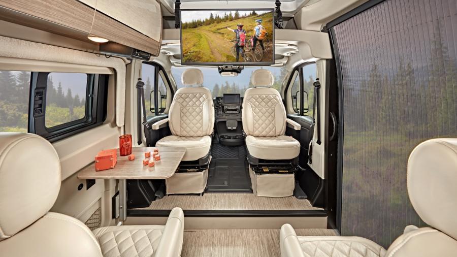 After a long day on the road, swivel the driver and passenger seats with six-way lumbar adjustment to face the interior and hang out in a cozy, relaxing space. Play games at the collapsible dinette table or enjoy watching the 32-inch front TV on a drop-down bracket in the Ethos Li 20DL. The sliding screen door at the entry lets the outside in while keeping the insects out. 
