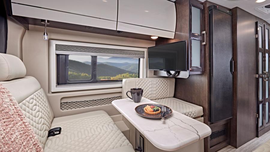 Find a great space to relax in the rear of the Expanse. Multiple seating spaces, another collapsible Lagun table and a 24-inch LED HD Smart TV all invite you to sit and stay awhile. 