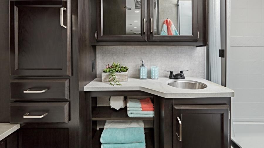 The Odyssey bathroom is just as impressive as the rest of the unit, with a shower with decorative ABS surround and skylight, stainless steel bathroom sink, toilet with foot flush and vent fan. Beautiful cabinetry offers plenty of storage for all your toiletries.