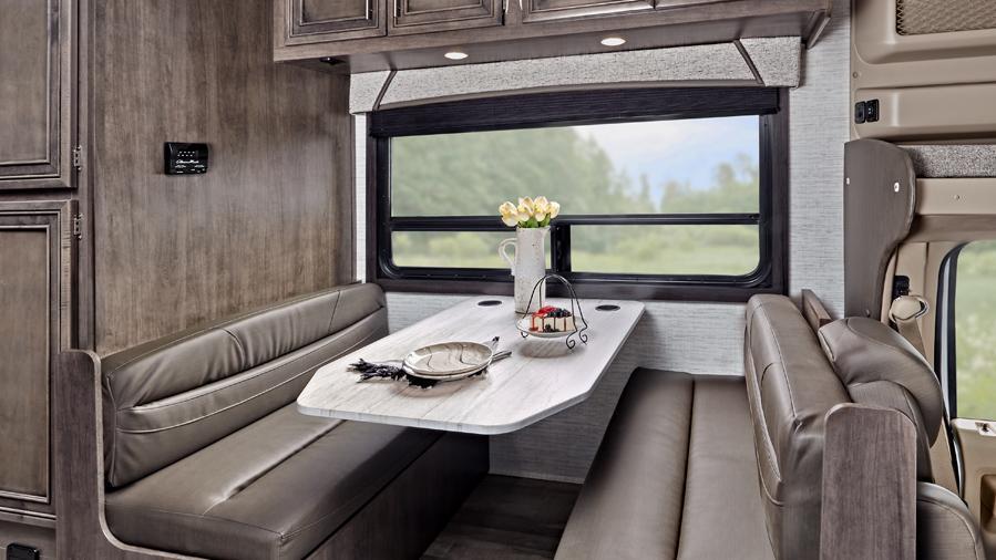 Odyssey SE 22C Dinette | The Odyssey SE 22C dinette has plenty of space for your legs with the Entegra-exclusive, easy-operation legless dinette table. There are car seat tethers on select floorplans. 