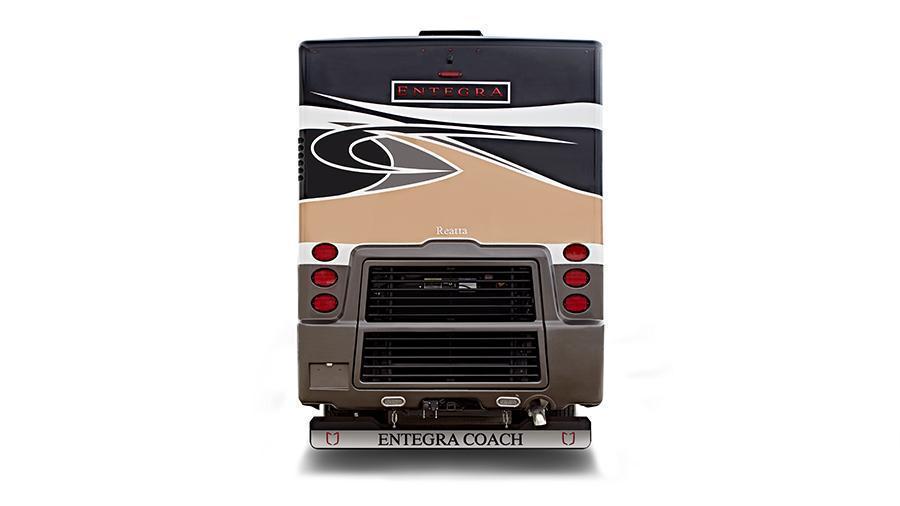 Reatta Rear Exterior | The rear exterior of the Reatta has a mud flap with a chrome “Entegra” nameplate.