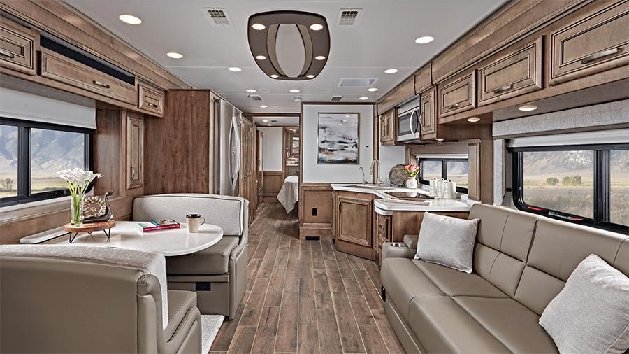Reatta 39BH Rear Interior | The 2024 Reatta features hand-laid, woodgrain porcelain tiled floors, a decorative ceiling feature with integrated accent lighting and manual solar day shades and blackout night shades (39BH Shown). 