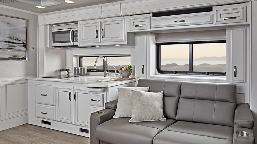 Reatta XL 40Q3 Kitchen and Hide-a-Bed | The Reatta XL 40QE optional hide-a-bed sofa offers extra seating and sleeping space and is another example of the premium furniture throughout the coach. 