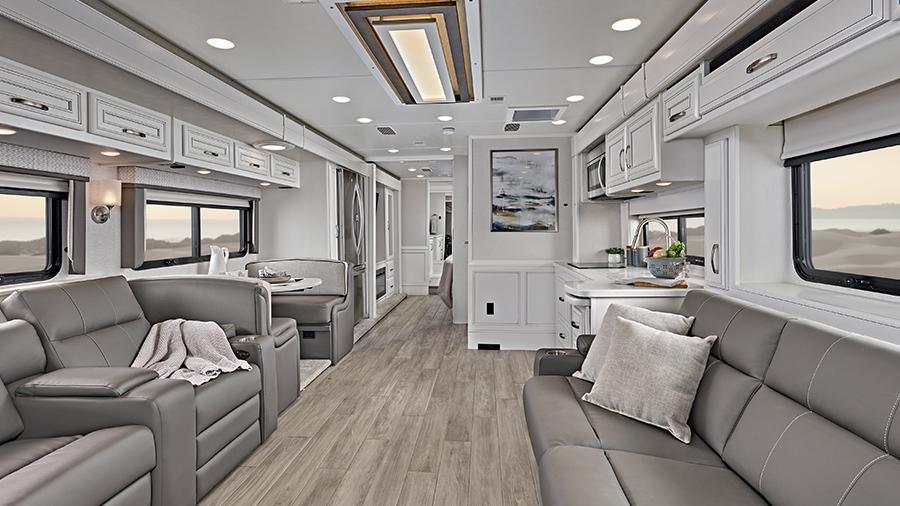 Reatta XL 40Q3 Rear Interior | Step into clean lines and visually stunning accents with the 2024 Reatta XL, featuring hand-laid, woodgrain porcelain tiled floors, a decorative ceiling feature with integrated accent lighting and manual solar day shades and blackout night shades (40Q3 Shown). 