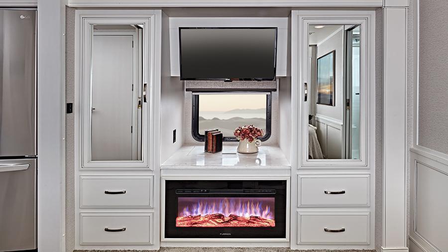 Reatta XL 40Q3 Wardrobe | The wardrobe pulls double duty in the Reatta XL 40Q3 with space for all your items and an entertainment center with 32-inch Samsung® LED 1080P Smart TV, Sony® Blu-Ray™ player and a 34-inch electric fireplace.  